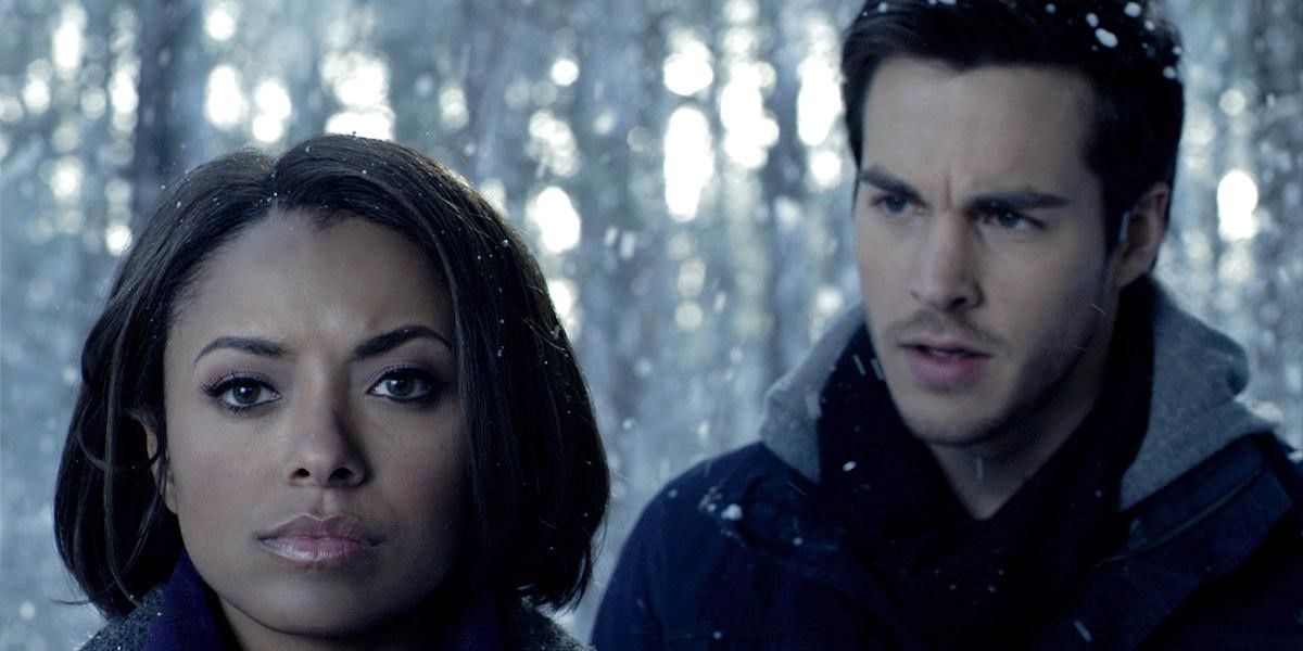Kai and Bonnie stand together in a snow storm in Vampire Diaries
