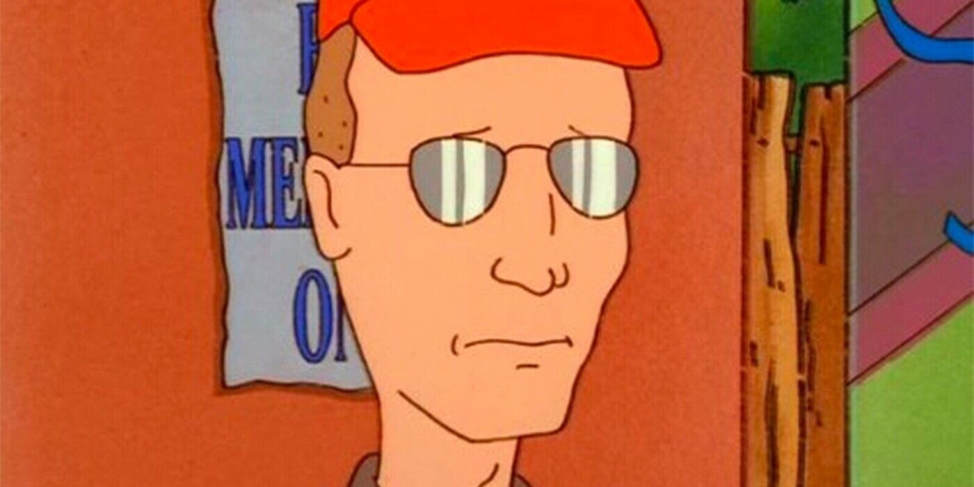King of the Hill's Dale looks sad in his sunglasses and orange hat in front of a door