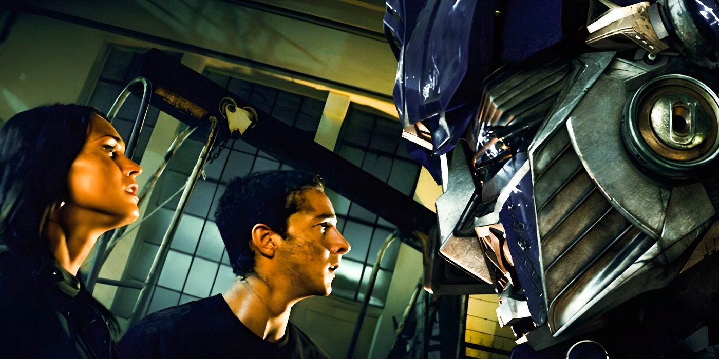 Megan Fox and Shia LaBeouf face Optimus Prime.