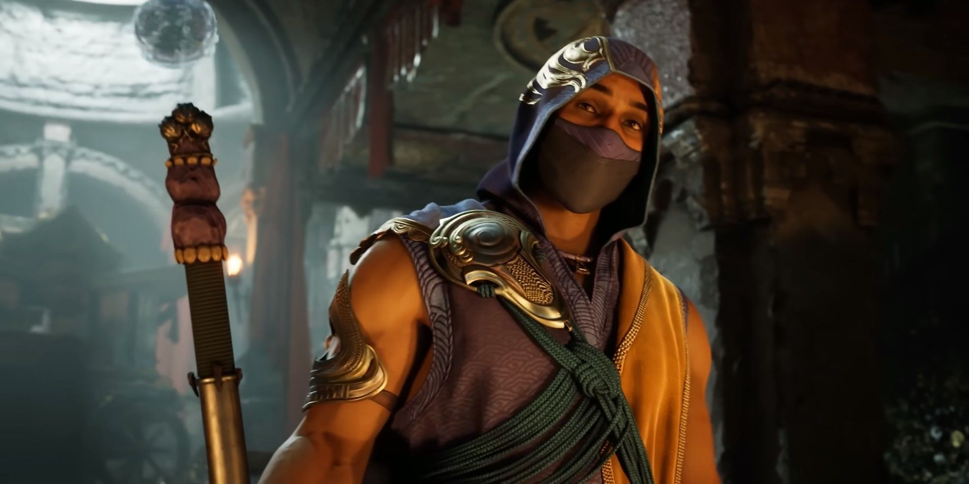 Rain speaking while wearing a mask and holding his water staff in Mortal Kombat 1