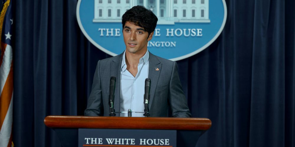 Taylor Zakhar Perez and Alex Claremont Diaz in Red White and Royal Blue giving a speech at a podium in the White House