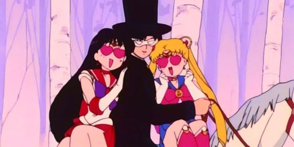 Sailor Mars and Sailor Moon sitting on a horse and making heart eyes with Tuxedo Mask in Sailor Moon