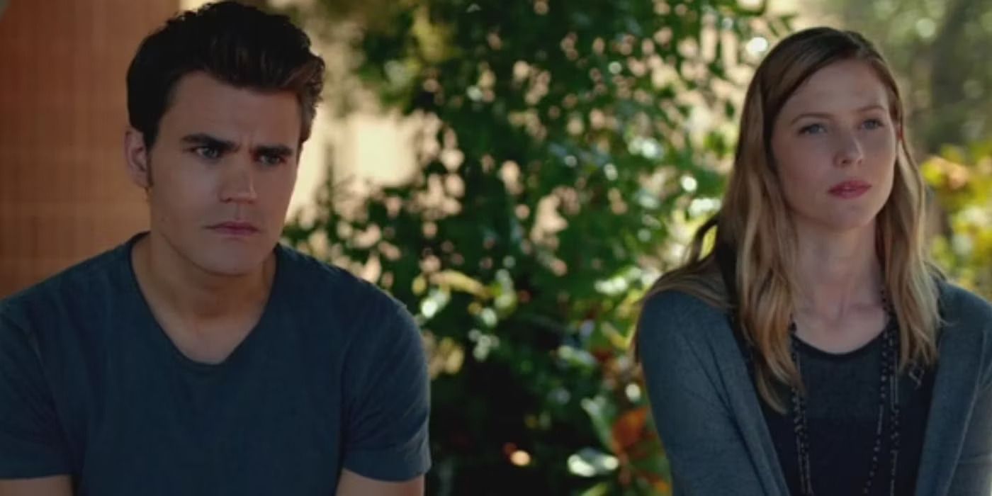 Stefan and Valerie sit at a distance and talk in The Vampire Diaries