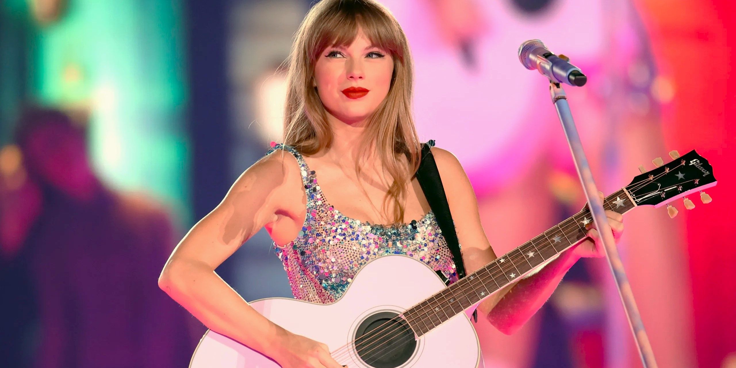 Taylor Swift sings with her Guitar