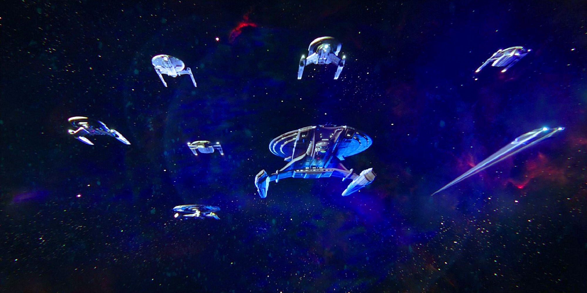 A grouping of redesigned Starfleet ships against a starfield from the series premiere of Star Trek Discovery