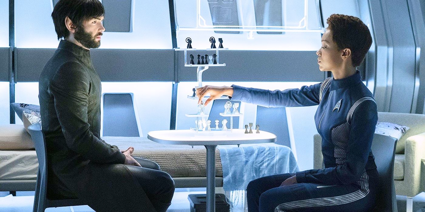 Bearded Spock sitting at a table playing 3d chess with Michael Burnham in Discovery