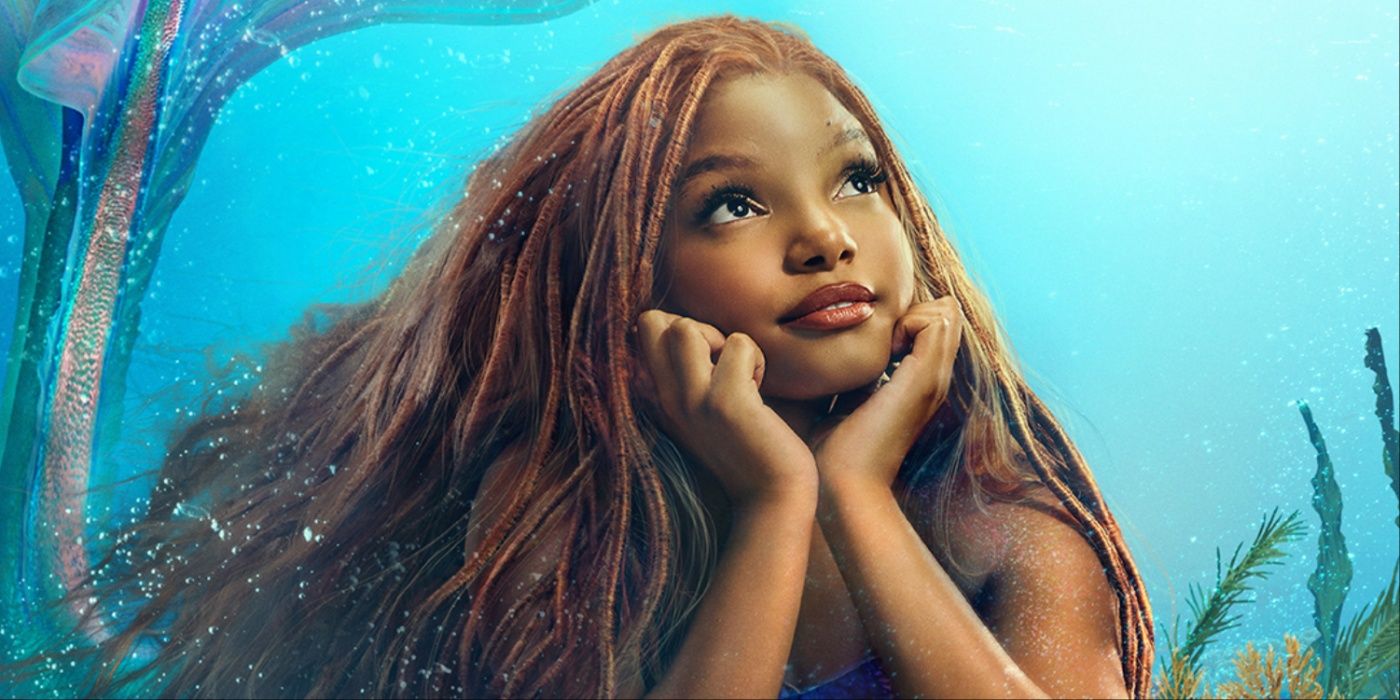 Ariel (Halle Bailey) looking up toward the surface in The Little Mermaid 2023. 