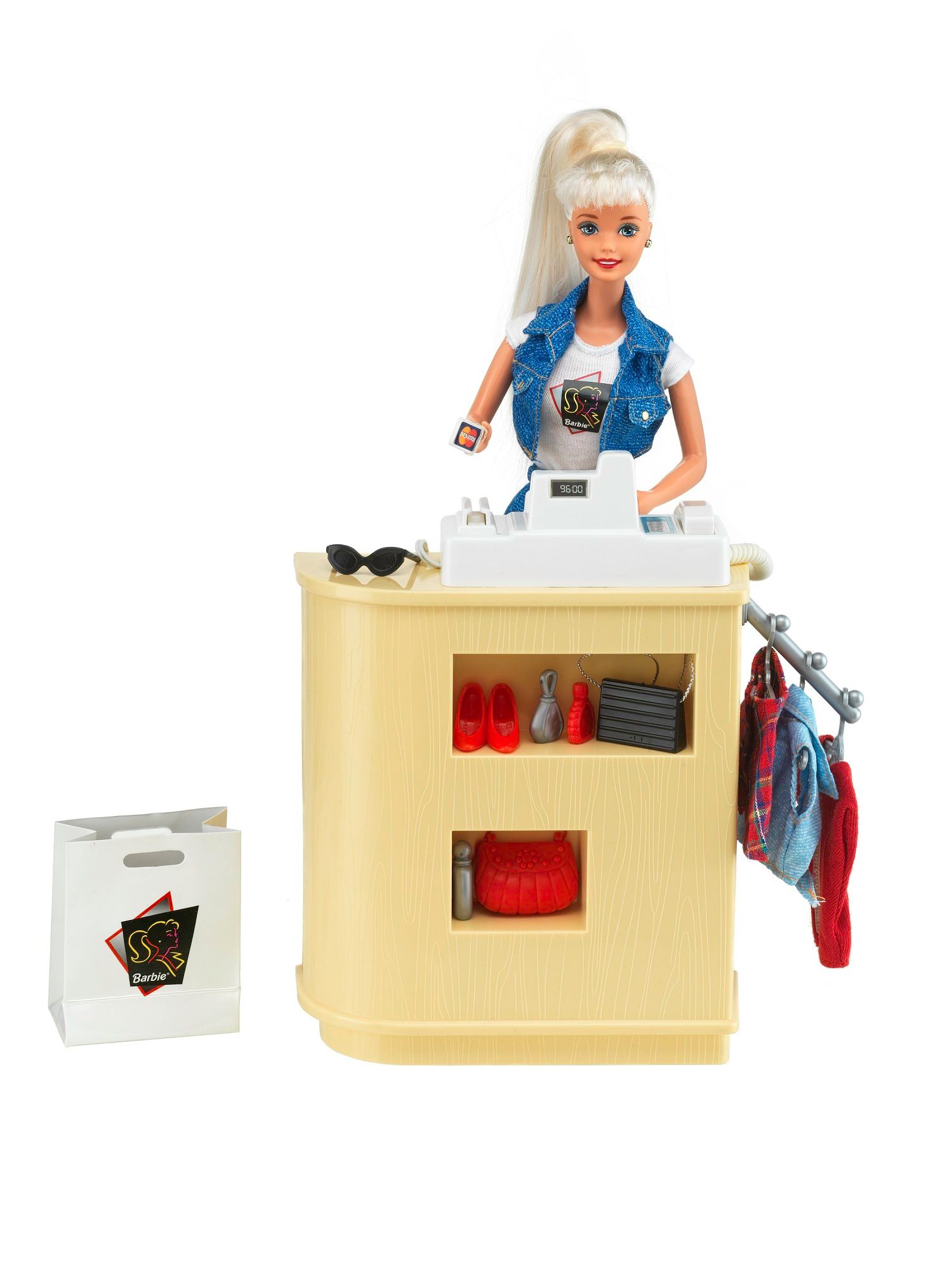 Brinquedo Barbie mostrando suas compras