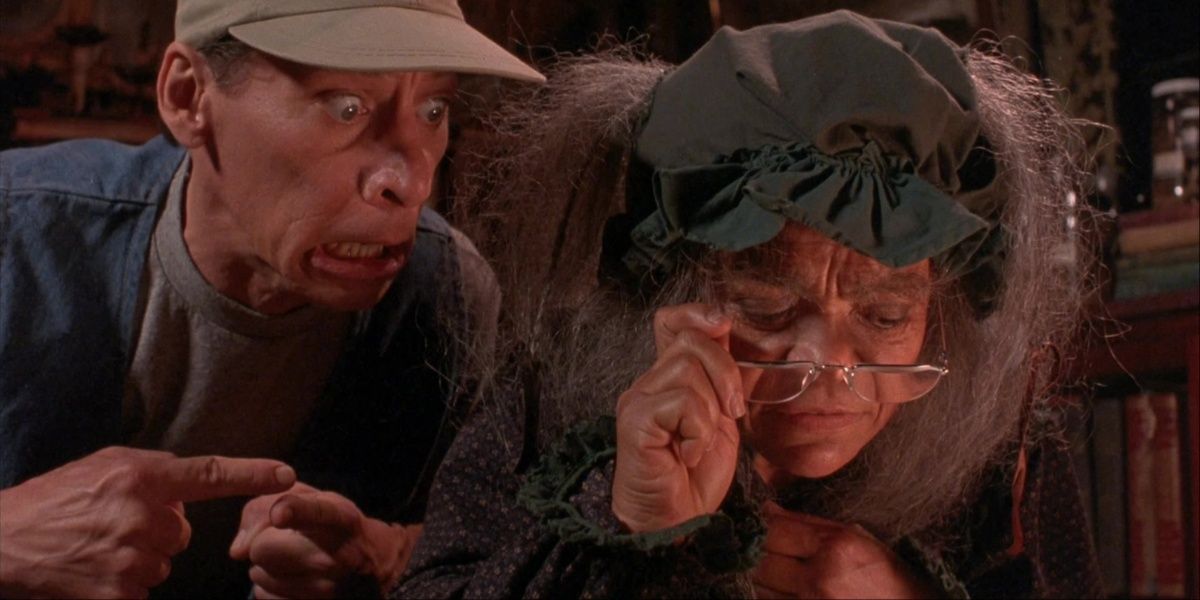 Ernest P. Worrell and Francis Hackmore looking over some documents in Ernest Scared Stupid