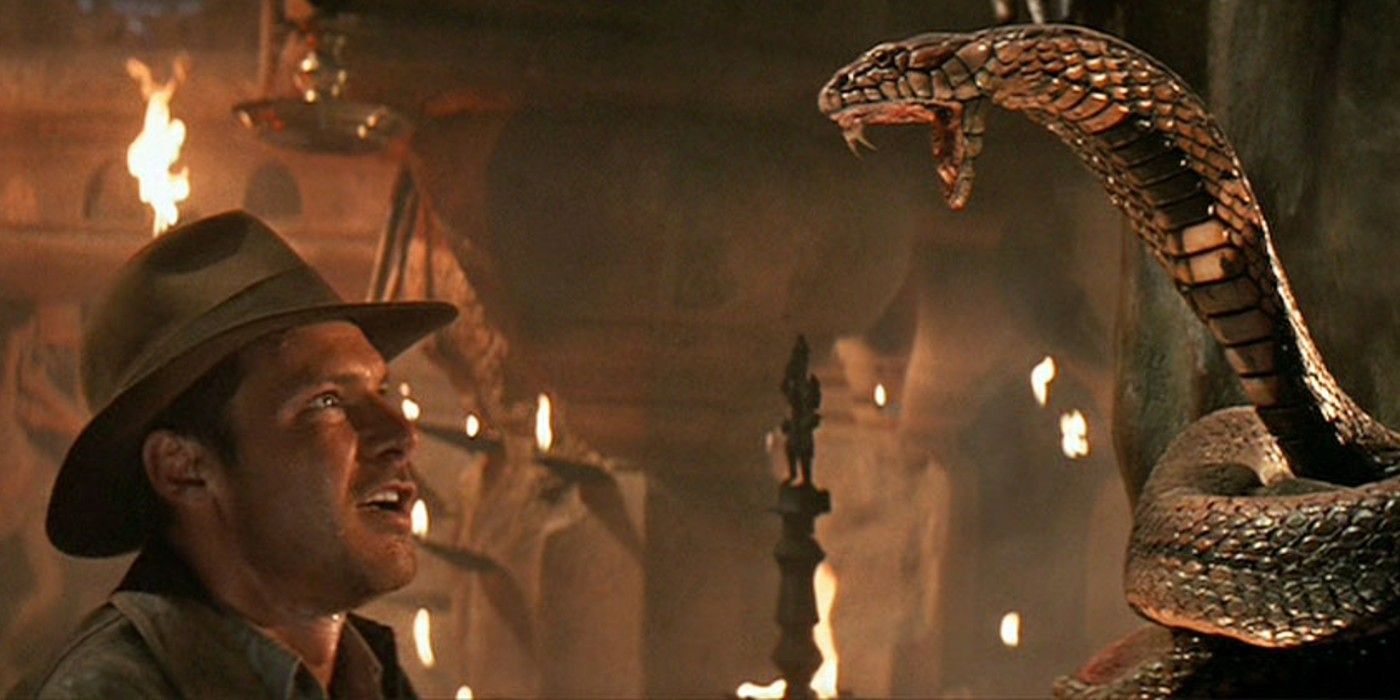 Harrison Ford in Indiana Jones and the Temple of Doom with a snake.