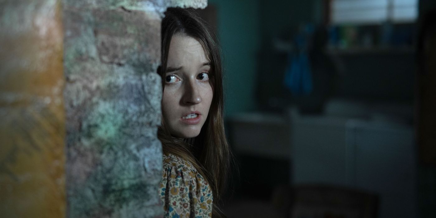 Brianna (Kaitlin Dever) hides from aliens in No One Will Save You