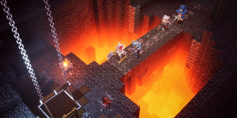 Four players cross over a narrow stone bridge above molten lava in Minecraft Dungeons