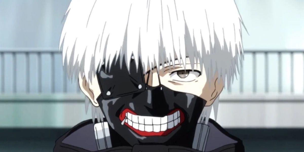 Ken Kaneki's iconic white-haired version with a forced smile in Tokyo Ghoul