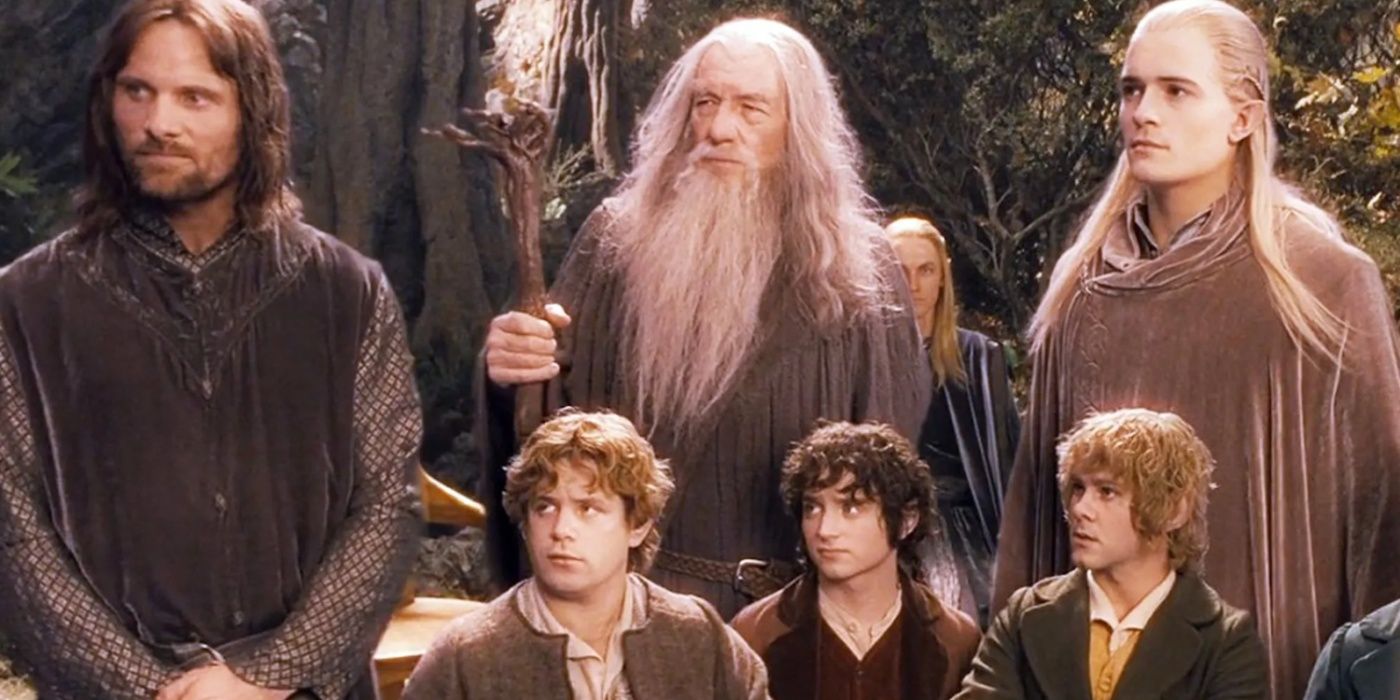 Aragorn, Gandalf, Legolas, Sam, Frodo and Merry stood together and looking to the side in The Lord of the Rings