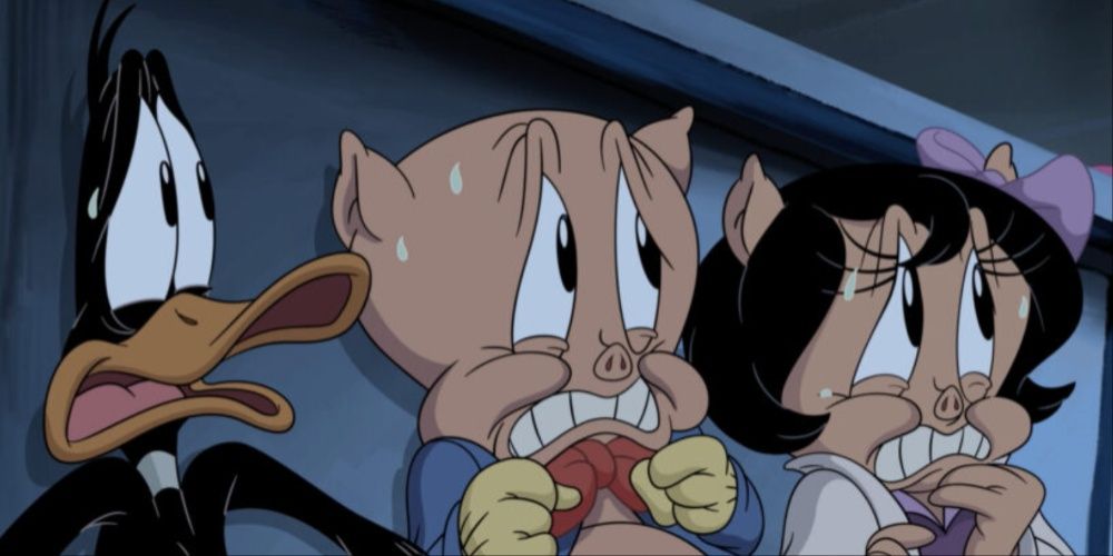 Daffy Duck, Porky Pig, and Petunia Pig looking scared and staring at something out of sight.