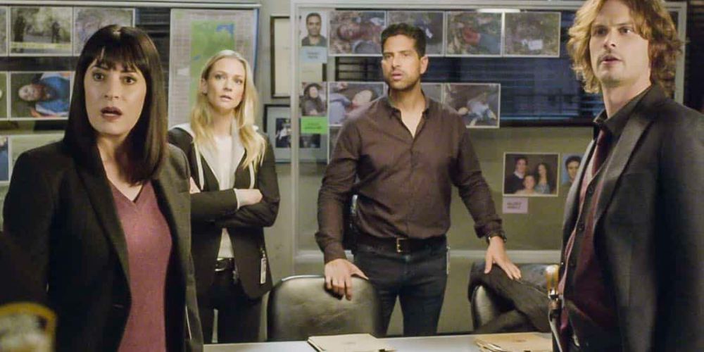 SSA Emily Prentiss, Jennifer Jareau, Luke Alvez and Dr.Spencer Reid by a case board in Criminal Minds.