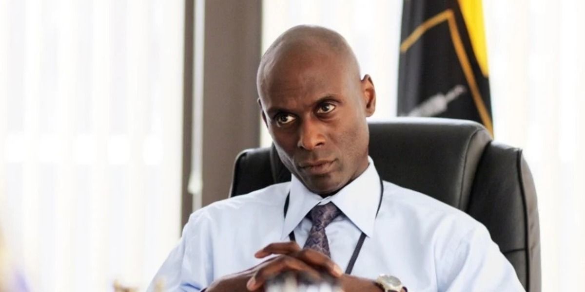 Lance Reddick as Cedric Daniels in his office with a stern expression in The Wire 