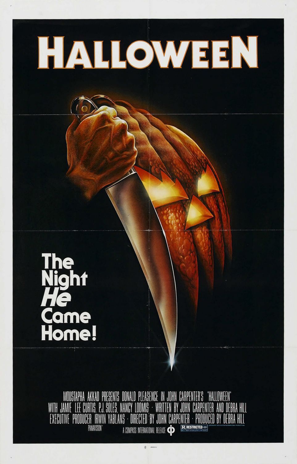 The Halloween movie poster shows a hand holding a knife next to a spooky jack-o-lantern.