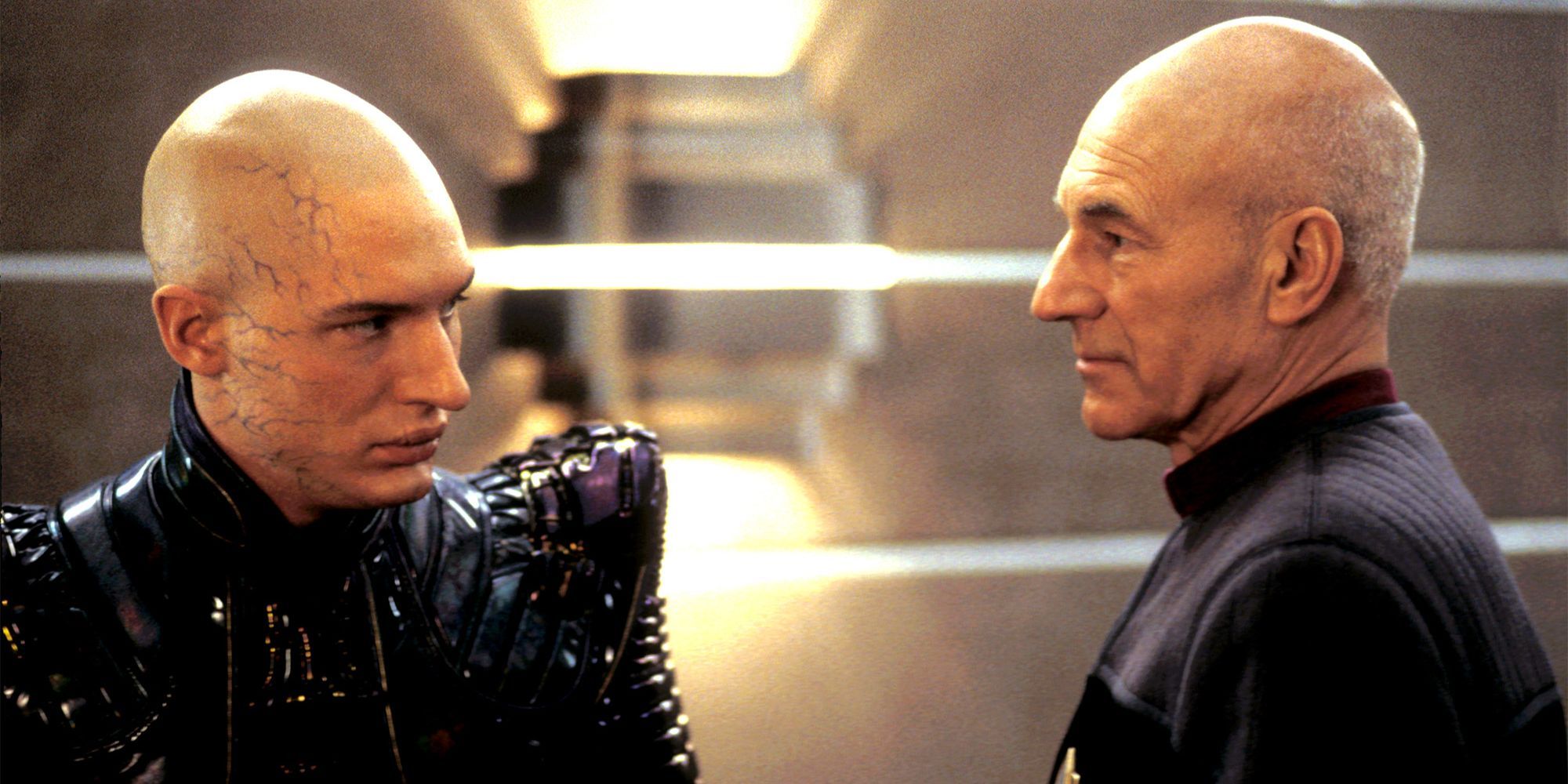 Tom Hardy and Patrick Stewart looking at each other in Star Trek: Nemesis.