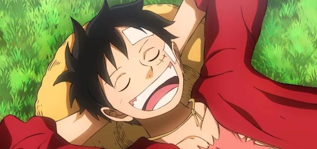 Monkey D. Luffy smiling and daydreaming in One Piece anime
