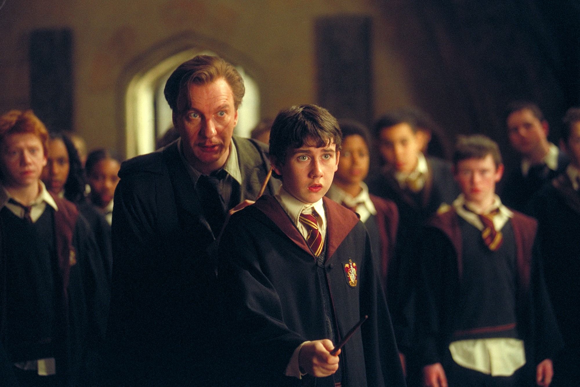 Remus Lupin teaches Neville Longbottom to cast a spell in Harry Potter and the Prisoner of Azkaban.