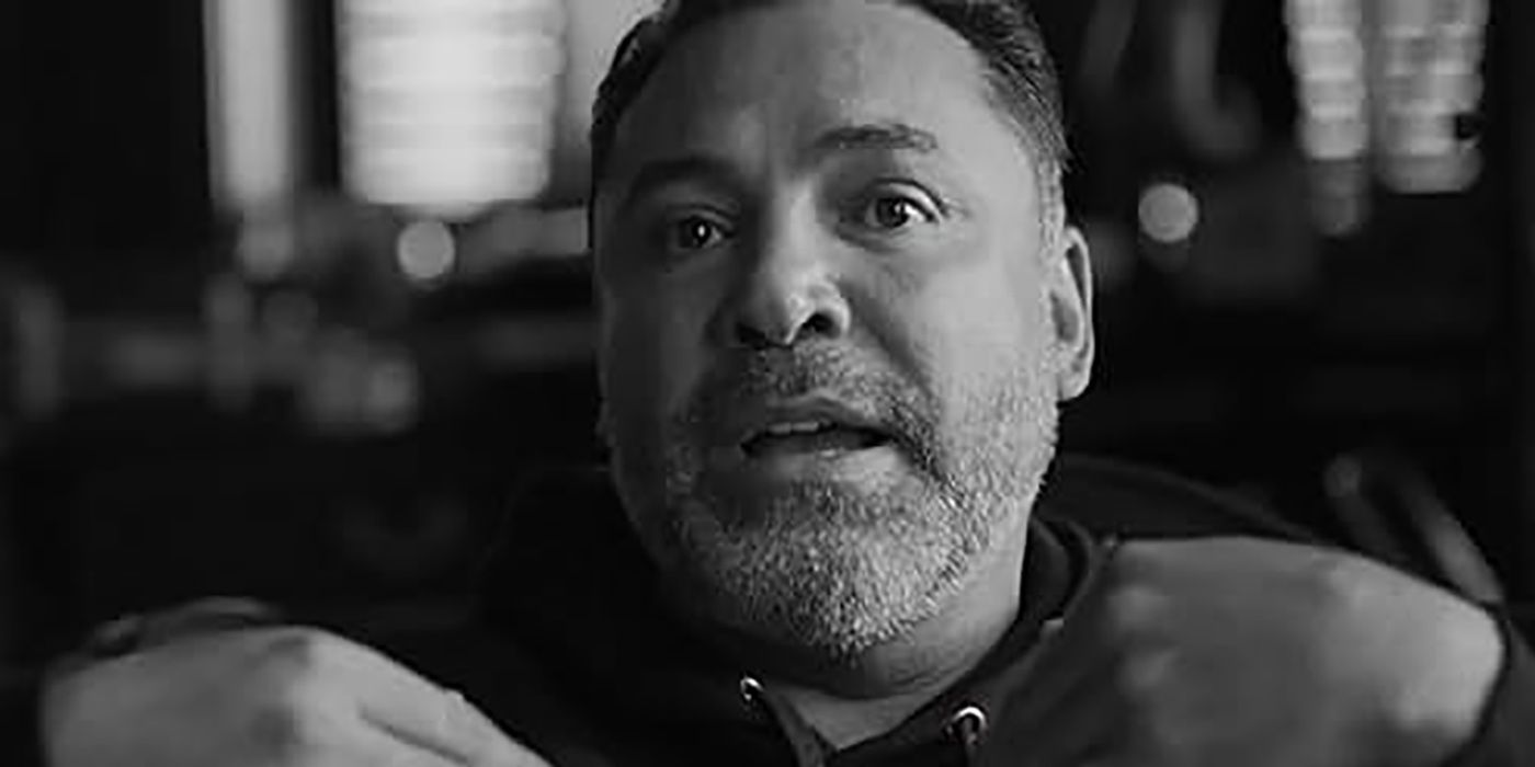 A black and white close-up of Oscar de la Hoya talking in a scene from The Golden Boy.
