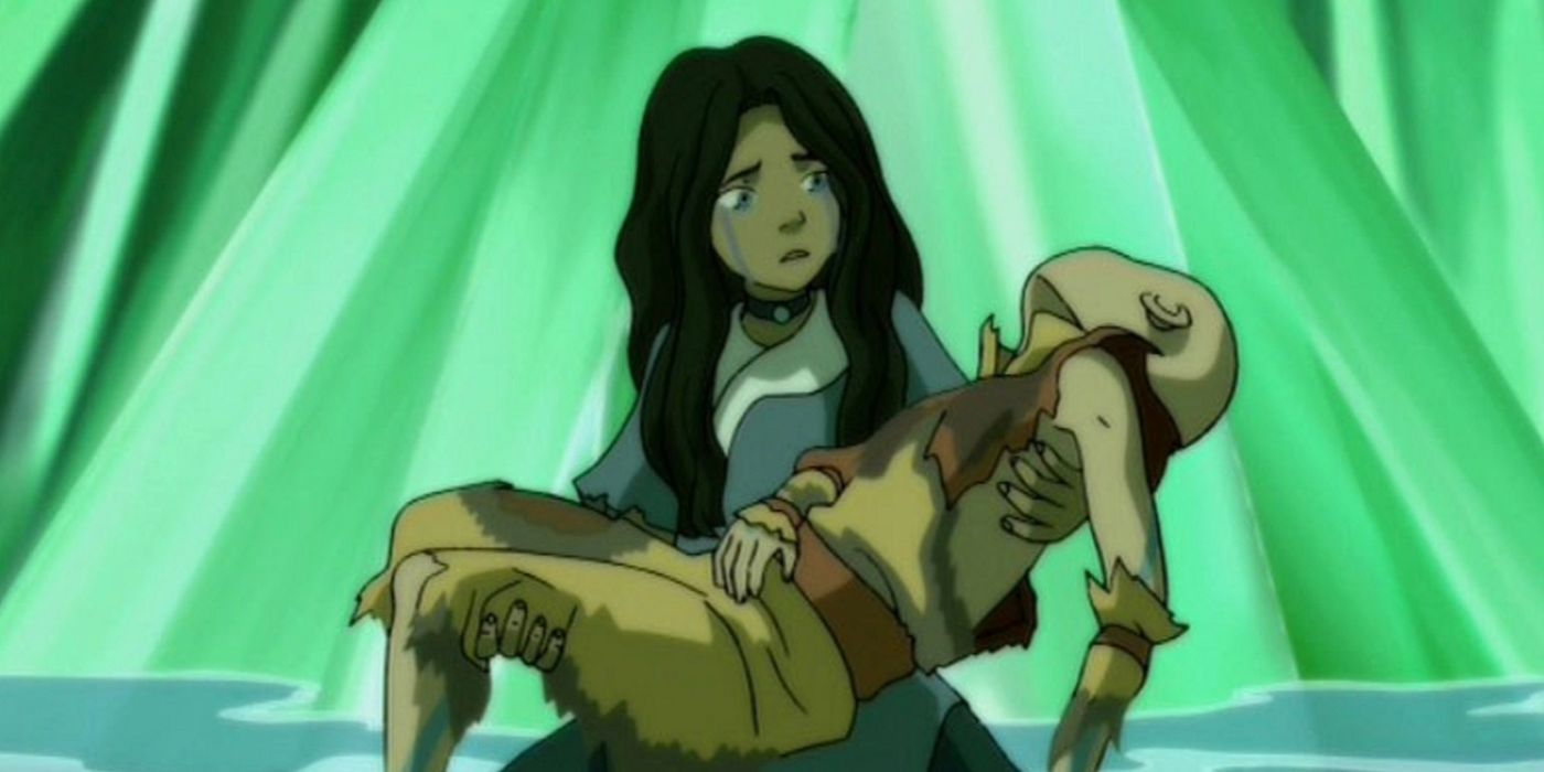 Katara crying while holding Aang’s lifeless body from Avatar: The Last Airbender. 