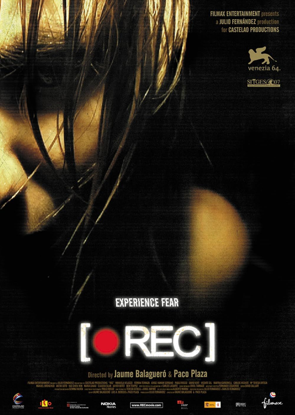 Angela stares at the camera on the cover of REC 2007