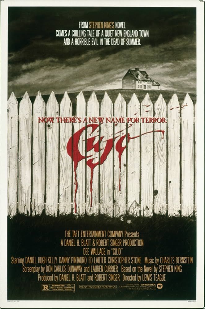 Movie poster of Cujo featuring a picket fence with the movie title