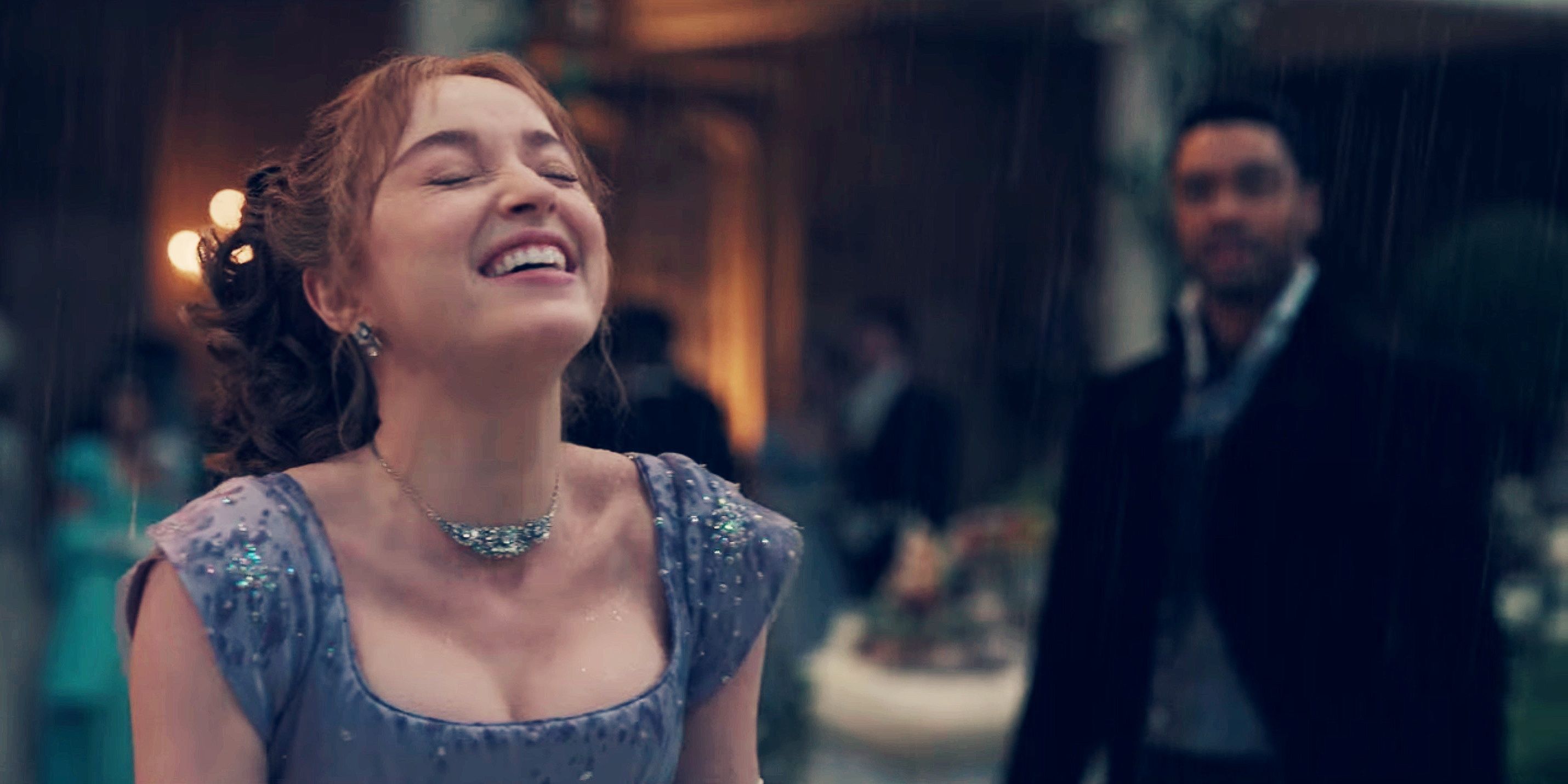 Daphne in the rain smiling while looking up while Simon looks at her in Bridgerton 