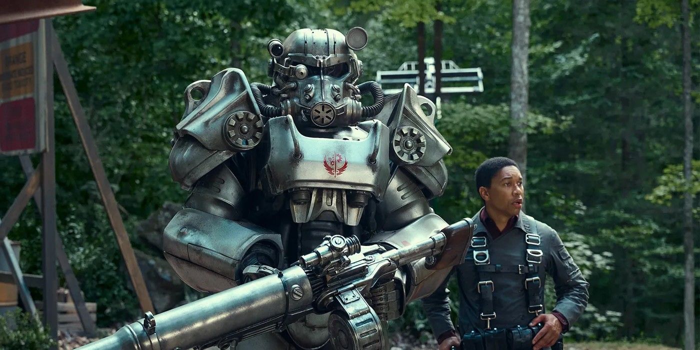 Uma foto do próximo show do Fallout, mostrando um homem andando ao lado de uma pessoa em Power Armor.