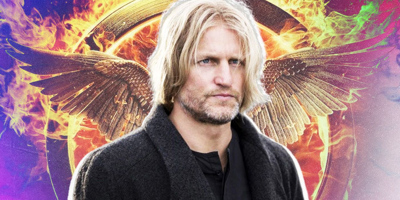 Haymitch Abernathy in front of a burning mockingjay pin in The Hunger Games.