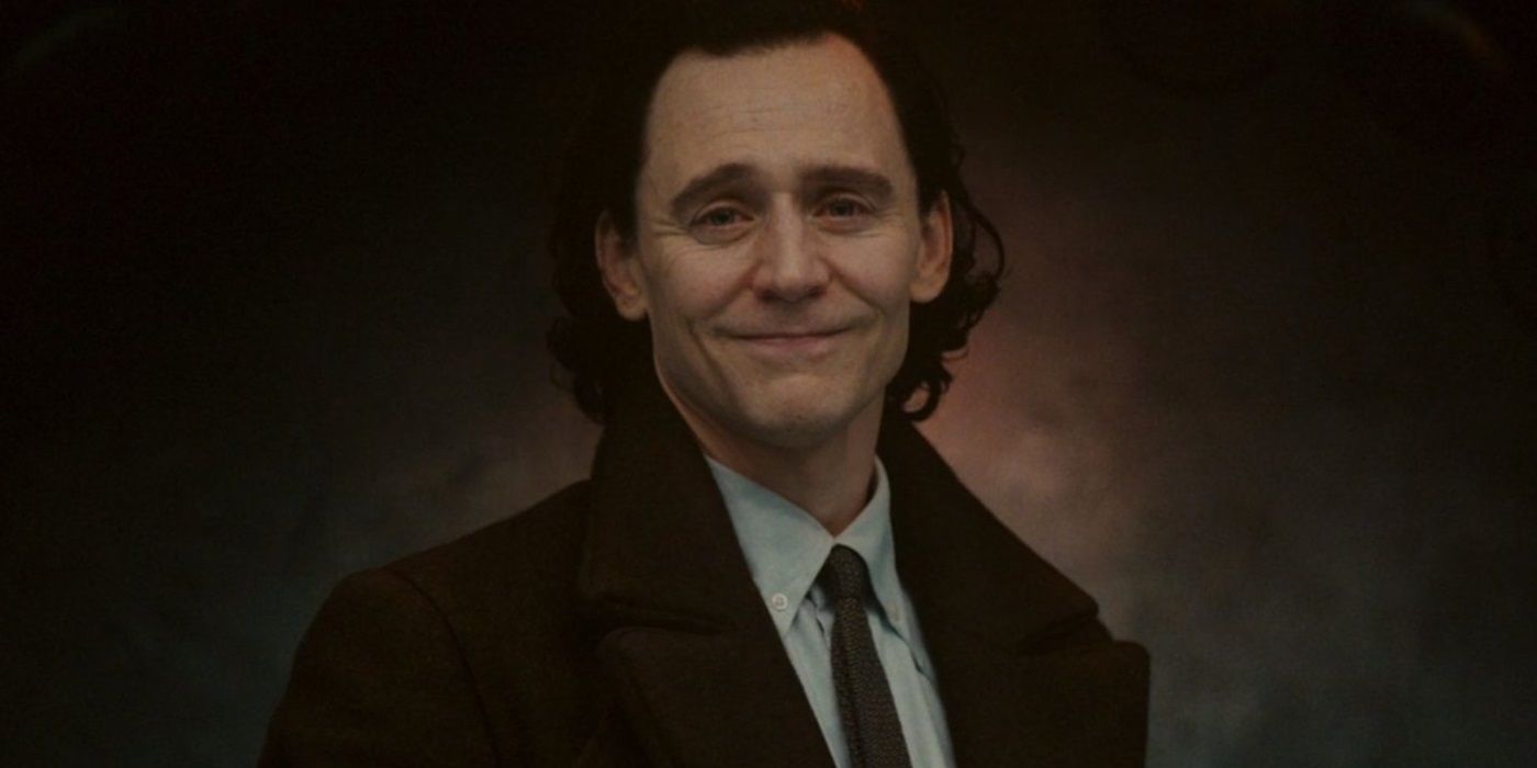 Loki wearing his TVA suit and a wistful smile as he prepares to make his final sacrifice in the Disney+ series