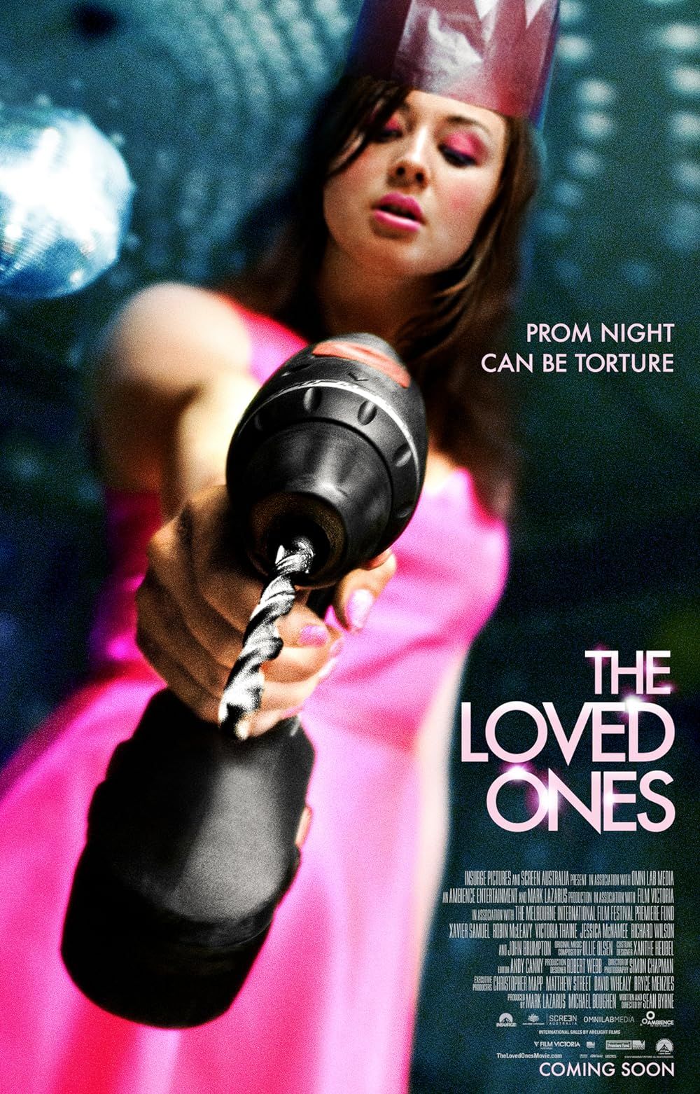 Lola aiming a drill on the cover of The Loved Ones