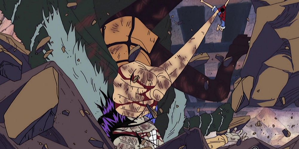 Monkey D. Luffy punches Crocodile in the face during a fight in One Piece