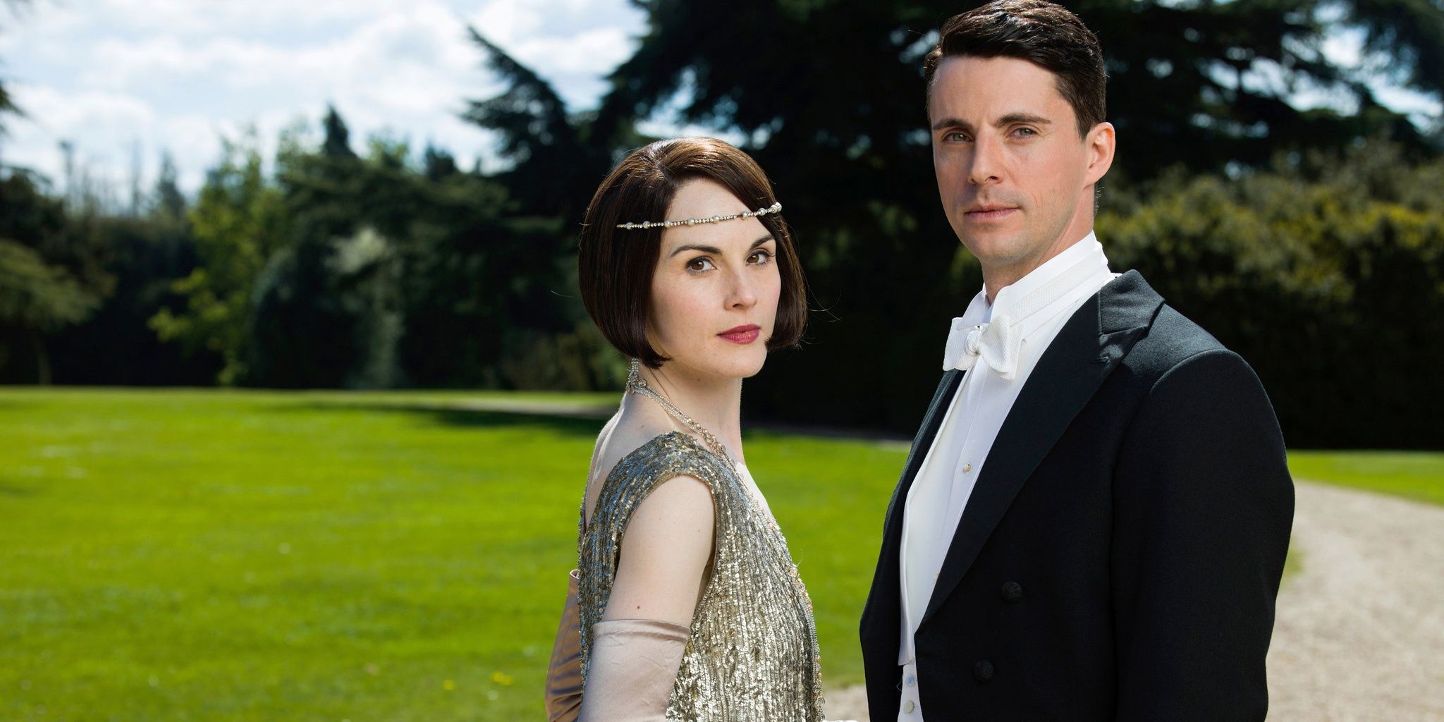 Mary e Henry olham para a câmera em Downton Abbey