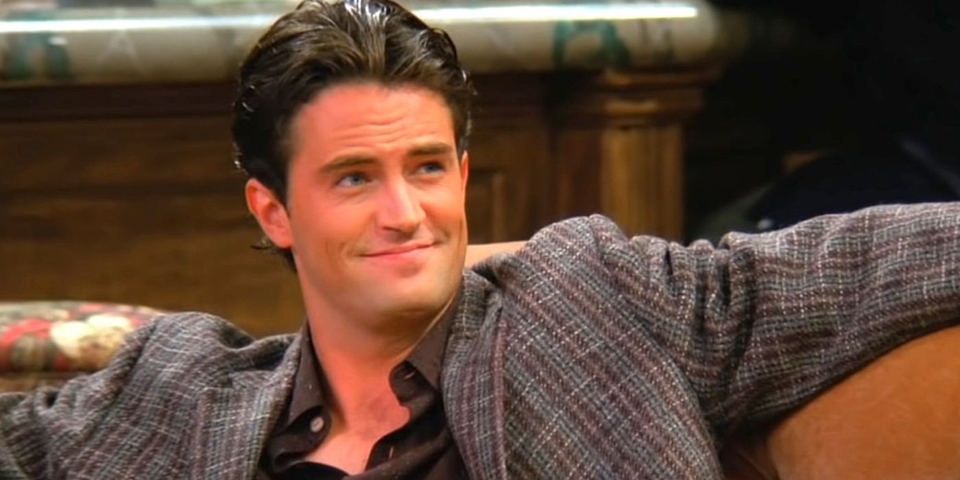 Matthew Perry as Chandler Bing sitting on a couch Friends