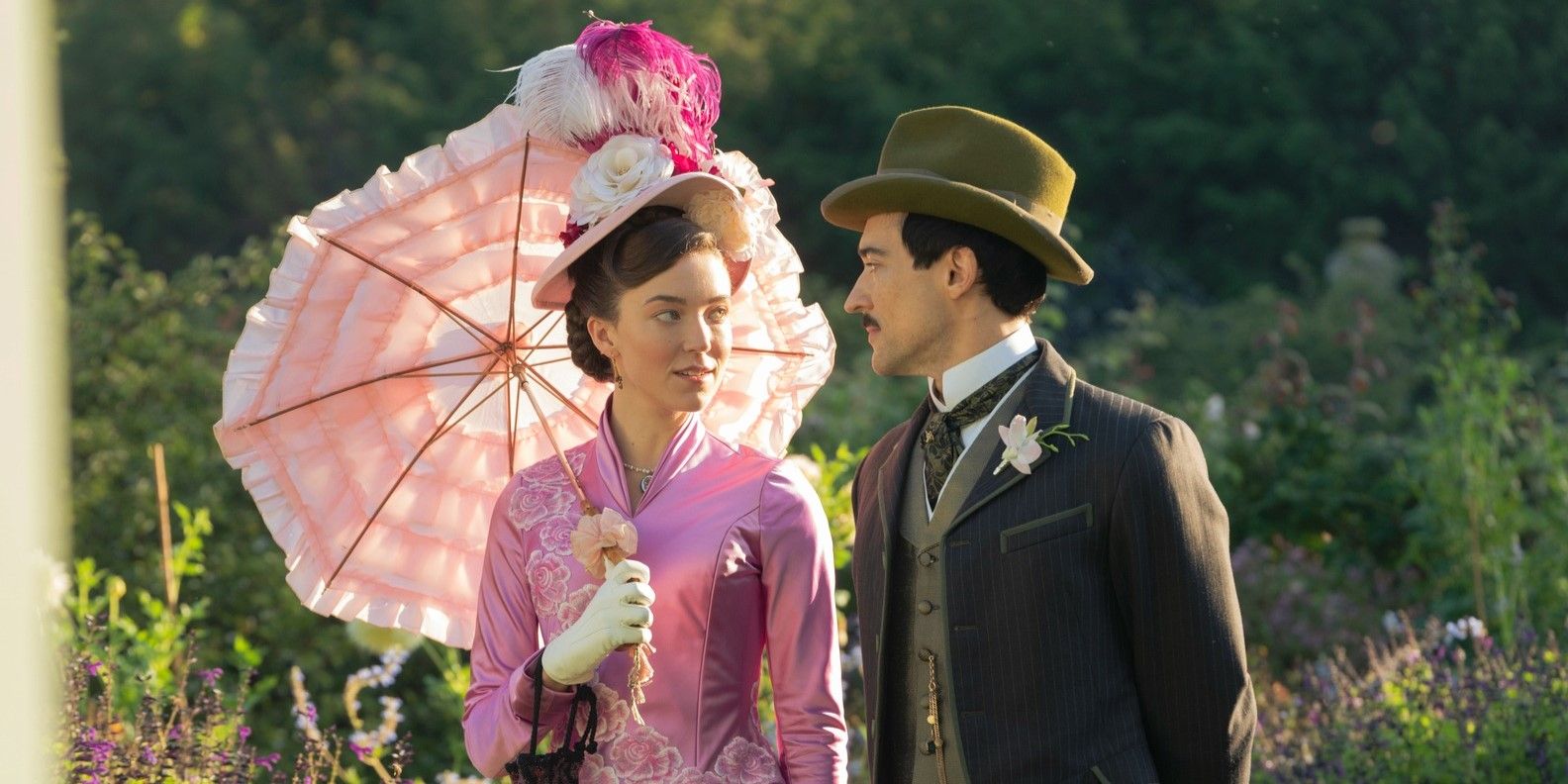 Nicole Brydon Bloom's Maude Beaton and Blake Ritson's Oscar van Rhijn in a garden in The Gilded Age.