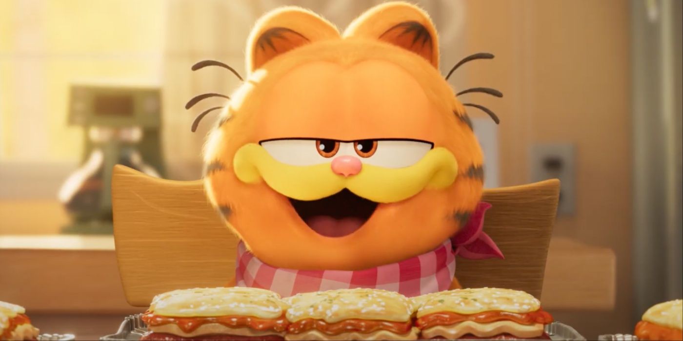 Garfield enjoying some lasagna with a napkin tied around his neck in The Garfield Movie.
