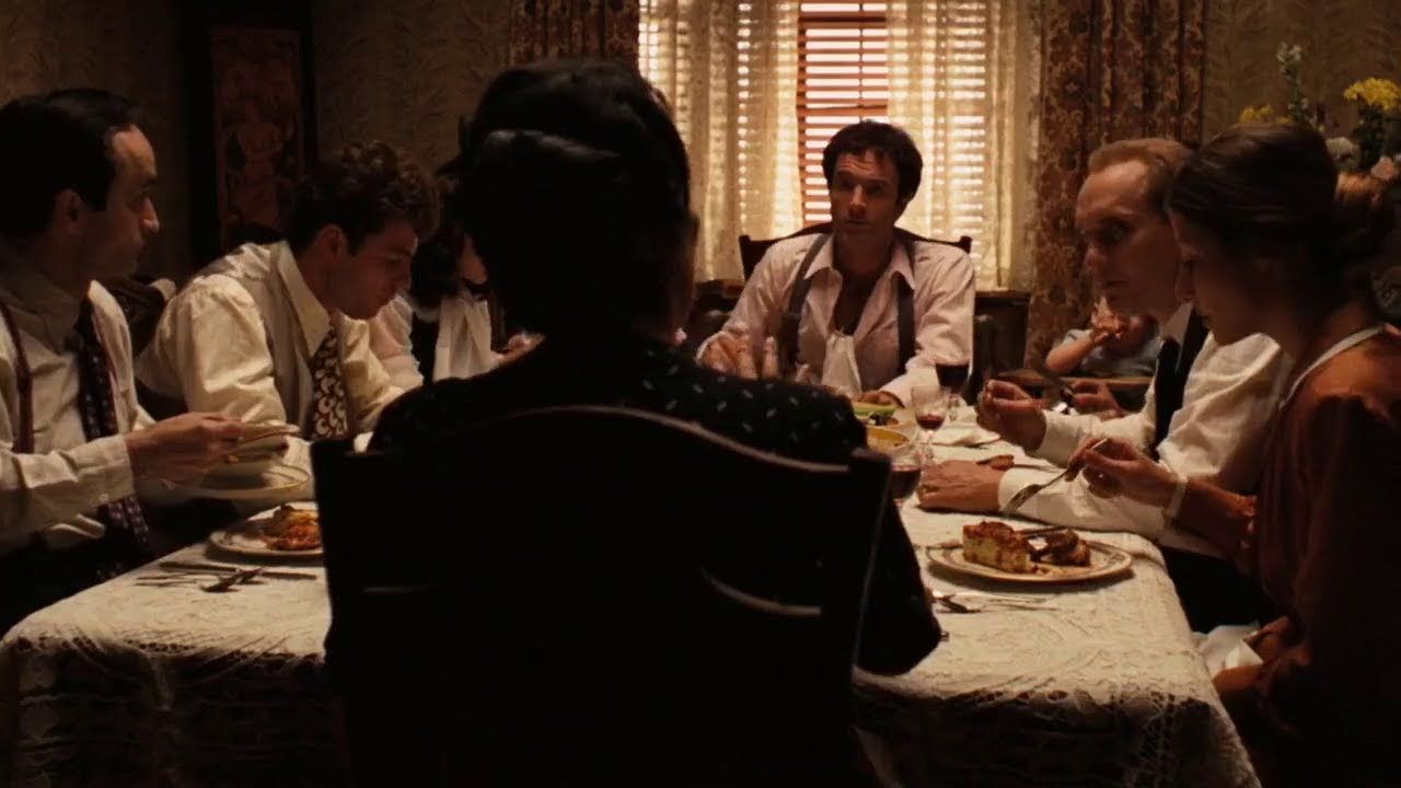 The Corleone Family sitting down to dinner in The Godfather.