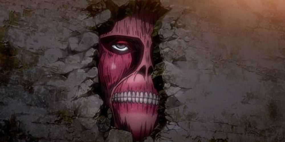 A Colossal Titan peeks through the wall in Attack on Titan