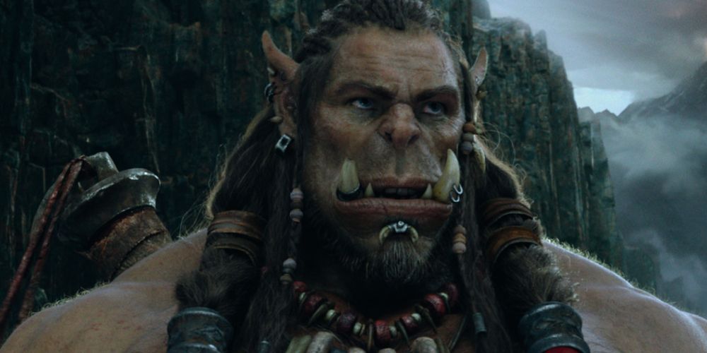 An Orc looks off into the distance in Warcraft (2016)