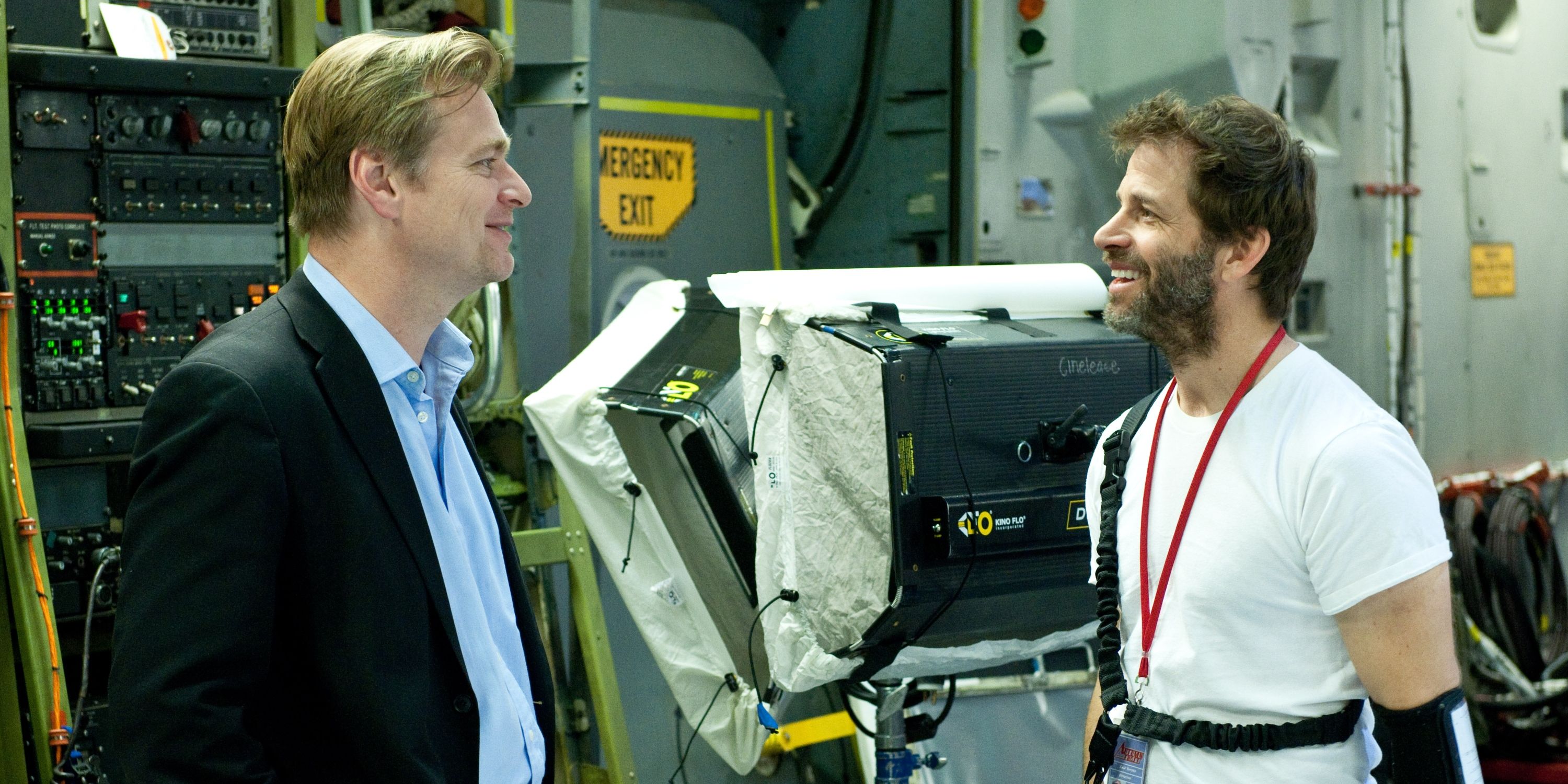 Christopher Nolan and Zack Snyder conversing on a set