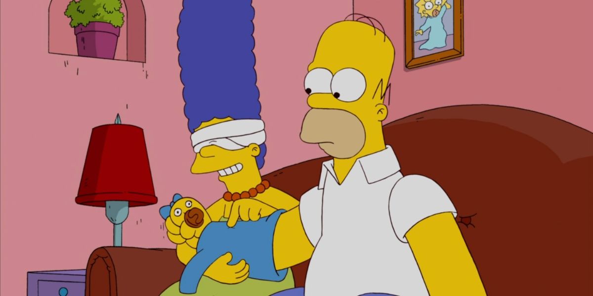 Homer tenta enganar Marge fazendo-a pensar que sua mão é Maggie em Os Simpsons