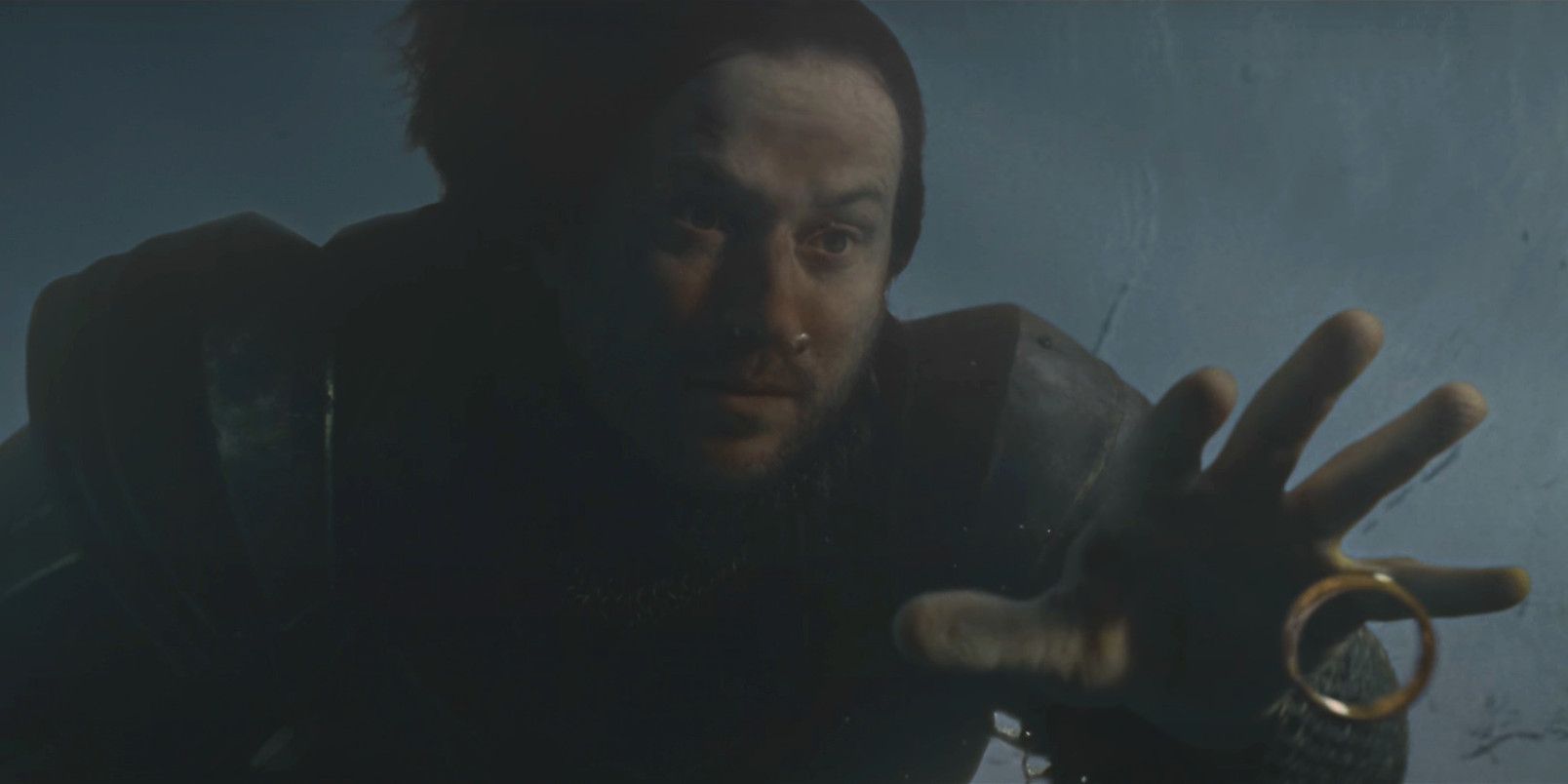 Isildur reaching for the One Ring underwater reaching for the ring before his death at the Battle of the Gladden Fields