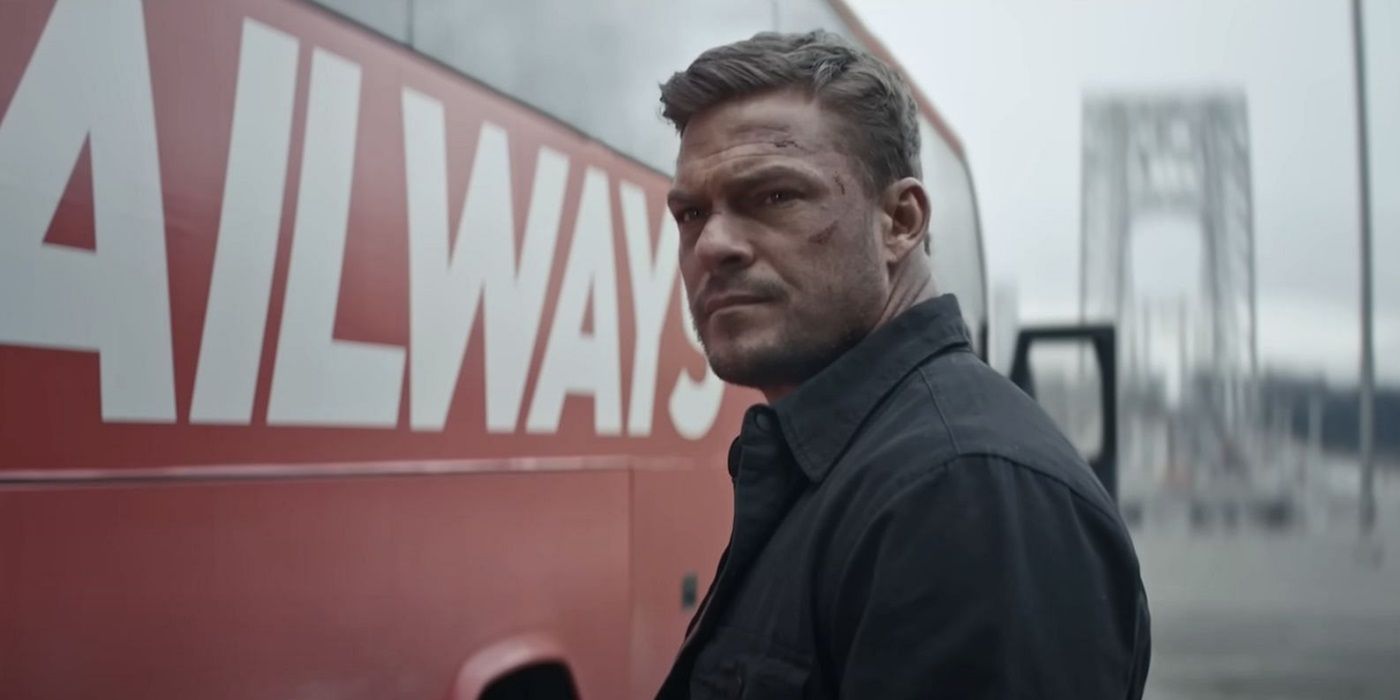 Jack Reacher standing in front of a truck looking angry