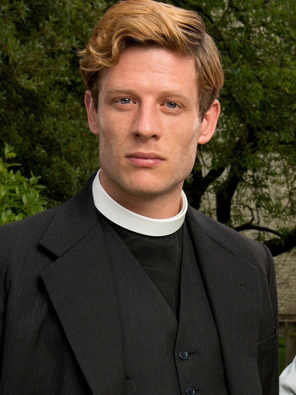 James Norton as Sydney Chambers in front of the sky on Grantchester