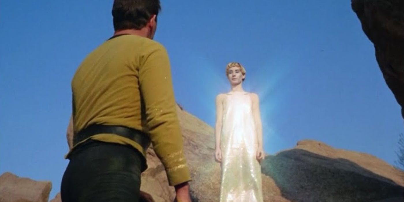 Kirk standing before a glowing Metron from Star Trek