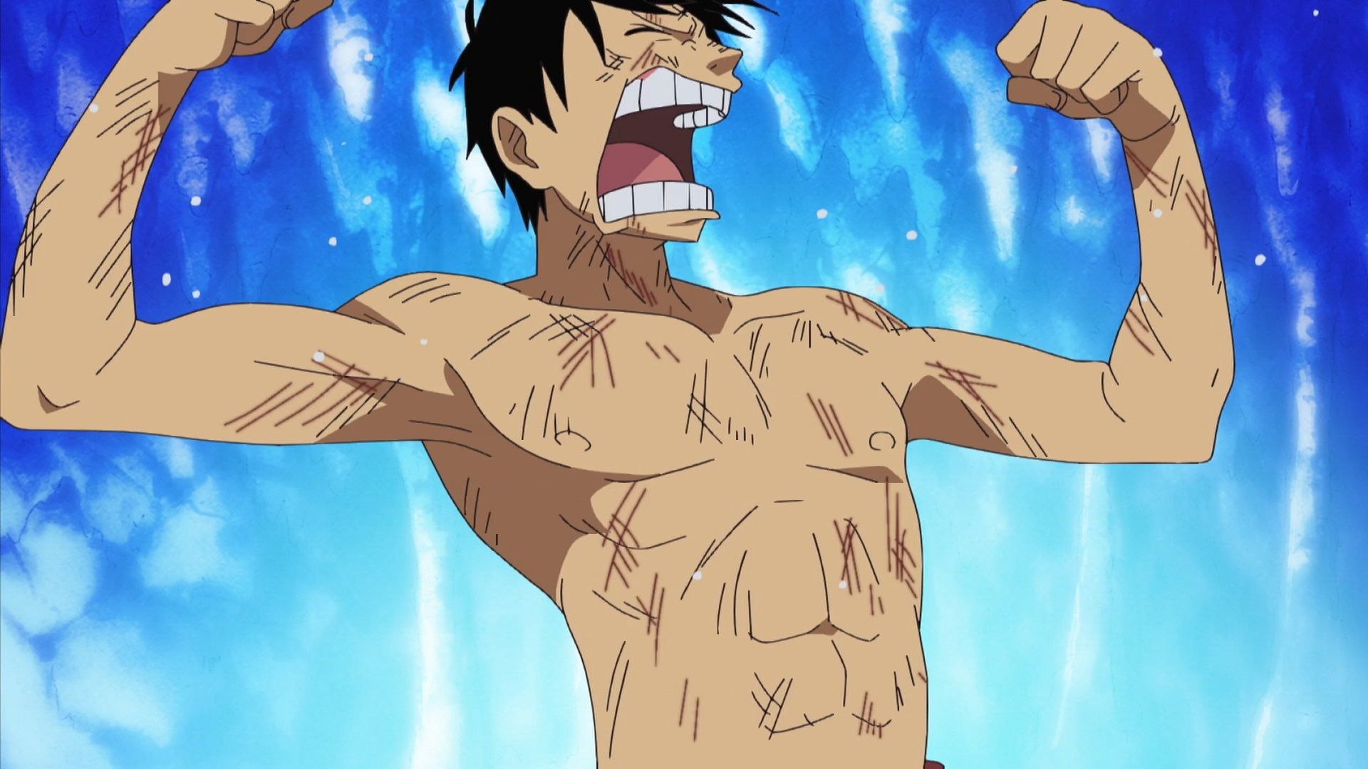 Luffy throws up his arms while baring his teeth in One Piece.