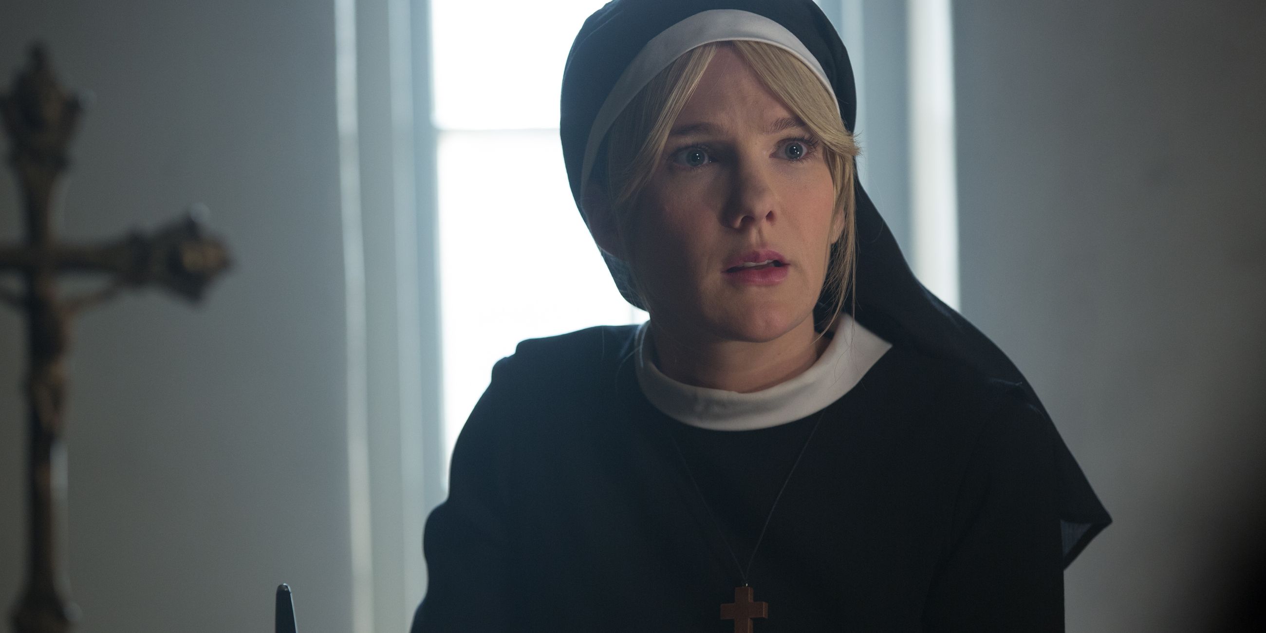 Sister Mary Eunice sits at her desk, writing